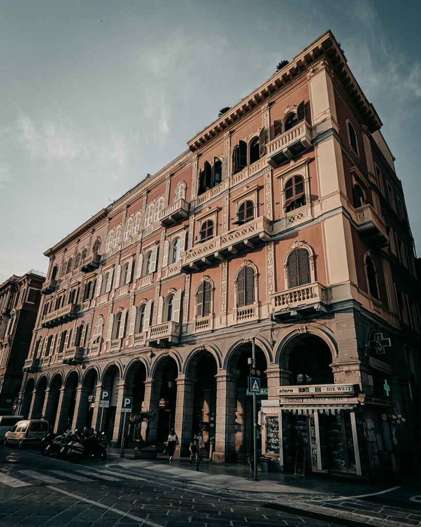 Elegant historic building with arched windows and balconies in Rome.